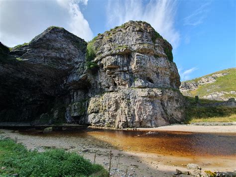 The Entrance To Smoo Cave In Durness Scotland An Underground Waterfall