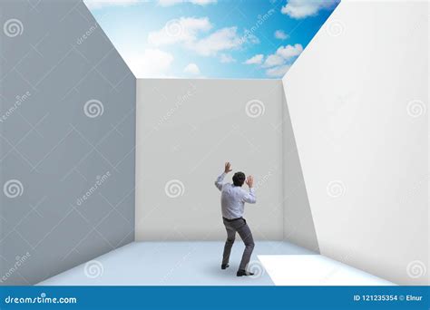 The Businessman Trying To Escape From Difficult Situation Stock Photo