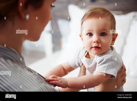 Portrait Of Confused Baby Looking At Camera Stock Photo Alamy