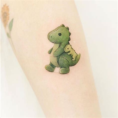 Pin By Elizabeth On Tatus Dinosaur Tattoos Mommy Tattoos Cute Tiny