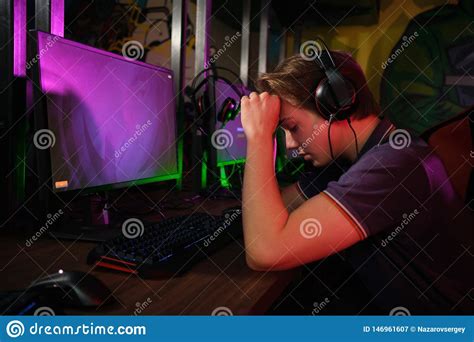 Professional Young Caucasian Gamer Playing Online On His Pc He Upset