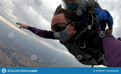 Skydiving Tandem With Protective Mask After The Lockdown Stock Photo