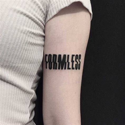 A Word Formless Tattooed In A Distorted Font On The Left Arm By Tattooist Yeontaan Tattoos