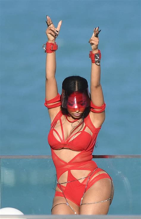 Nicki Minaj Shows Off Her Famous Curves In A Red Cutout Bodysuit