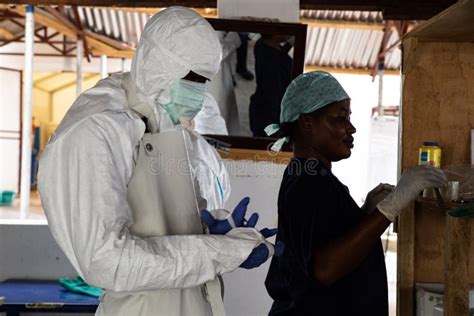 lunsar sierra leone april 29 2015 a nurse and medical worker prepare to enter dangerous zone