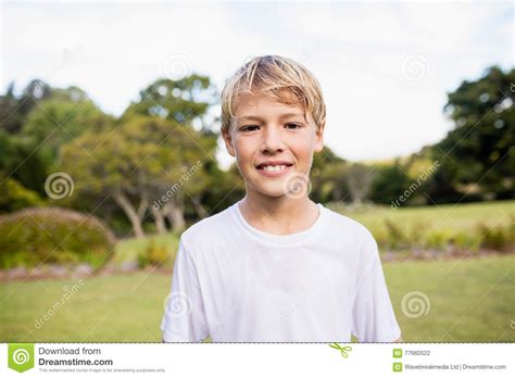 Kid Posing At Camera During A Sunny Day Stock Photo Image Of Green