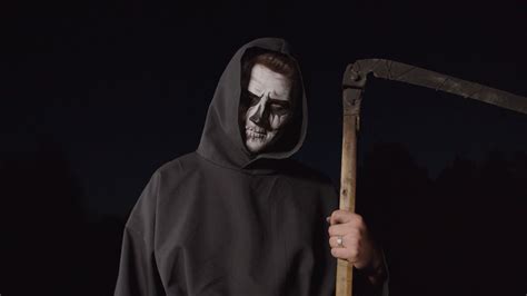 Portrait Of Eerie Grim Reaper In Black Cloak Stock Footage Sbv