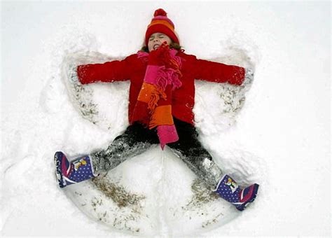 Pictures Of Kids Making Snow Angels During Winter Storm