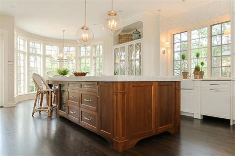 Wonderfully Appointed White Kitchen Is Accented With A Walnut Stained