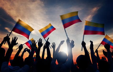 Silhouettes Of People Holding Flag Of Colombia Stock Image Image Of