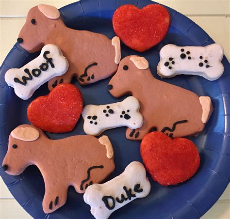 Some Dogs And Hearts Are On A Blue Plate