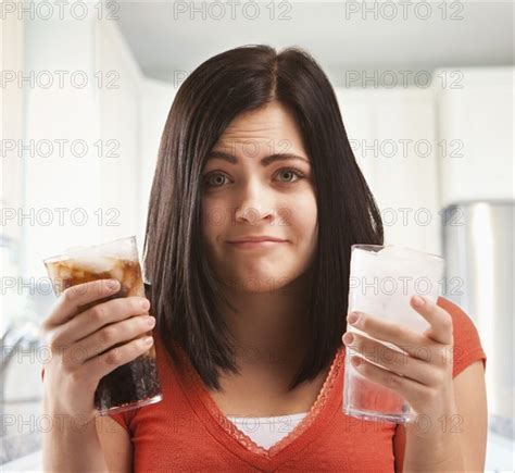 Caucasian Woman Holding Glasses Of Soda And Water Photo12 Tetra