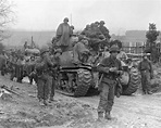 8 March 1945: After a break, 2nd Infantry Division troops load up on ...