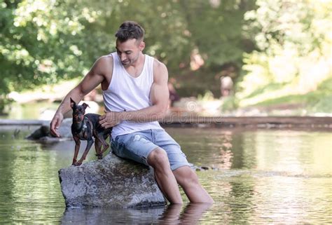 Portrait Of Handsome Young Man With Dog Outdoor Stock Image Image Of