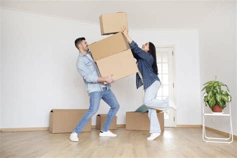 Relocation Day Happy Young Spouses Carrying Cardboard Boxes While
