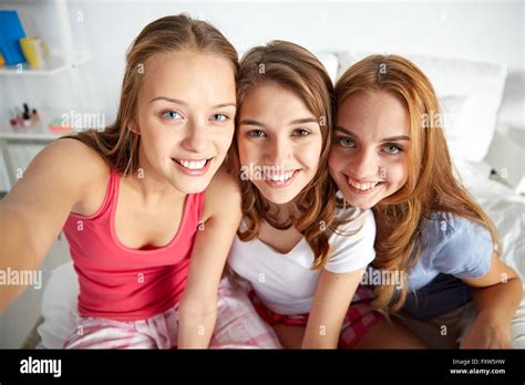 Three Teenage Girls Taking Selfie Home High Resolution Stock