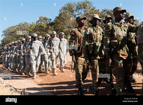 Us And Zambian Soldiers March In Formation During The Opening Day