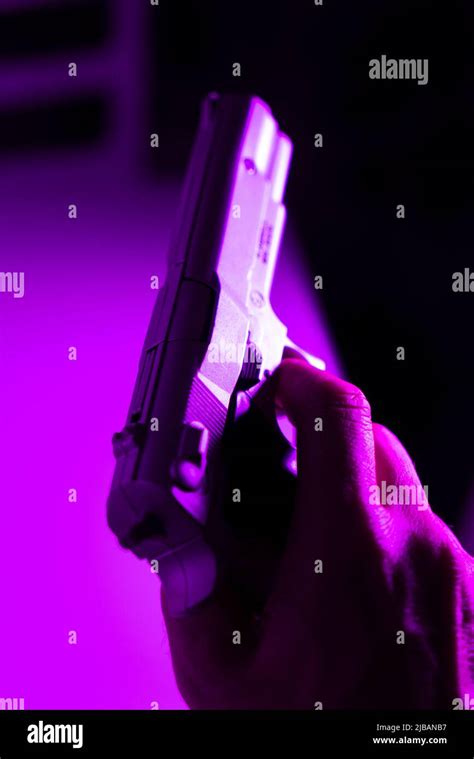 Hand Of Man Holding 9mm Pistol Gun In Crime Thriller Book Cover Design