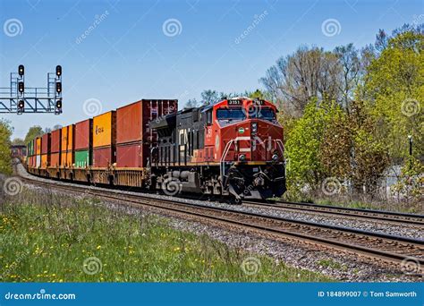 Cn 3151 Locomotive Diesel Engine Leads A Long Freight Train Editorial