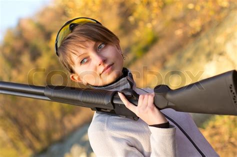 Young Beautiful Girl With A Shotgun Stock Photo Colourbox