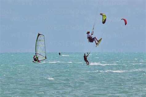 Kite Surfing And Windsurfing At Long Bay Beach On The South Coast Of