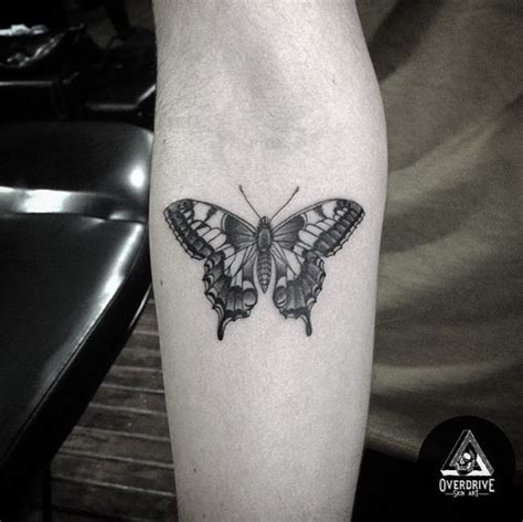 Simple black butterfly tattoo on wrist. 28 Beautiful Black and Grey Butterfly Tattoos - TattooBlend