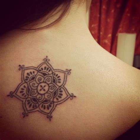 This red and black henna tattoo paints a trail from the wrist towards the index finger. first tattoo! henna style lotus flower | Henna style ...