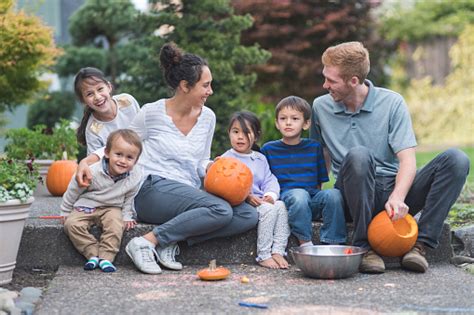 Multiethnic Group Of Kids Carving Pumpkins Stock Photo Download Image