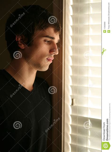 Sad Young Man Looking Out Window Stock Photo Image Of Concept