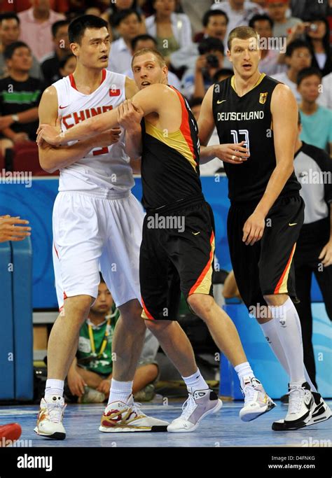 Yao Ming L Of China Vies With Dirk Nowitzki C And Patrick Femerling
