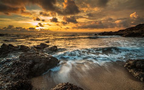 Dark Clouds Over Ocean At Sunset