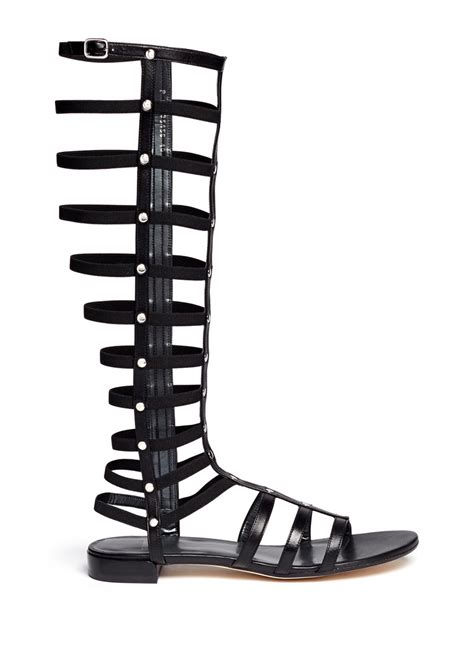 lyst stuart weitzman gladiator elastic band flat leather sandals in black