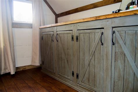 Sliding cabinet doors with inset track and glides the doors are bypass, so either one can be closed on either side of the cabinet. Ana White | Scrapped the Sliding Barn Doors, Rustic Cabinet Doors Instead - DIY Projects