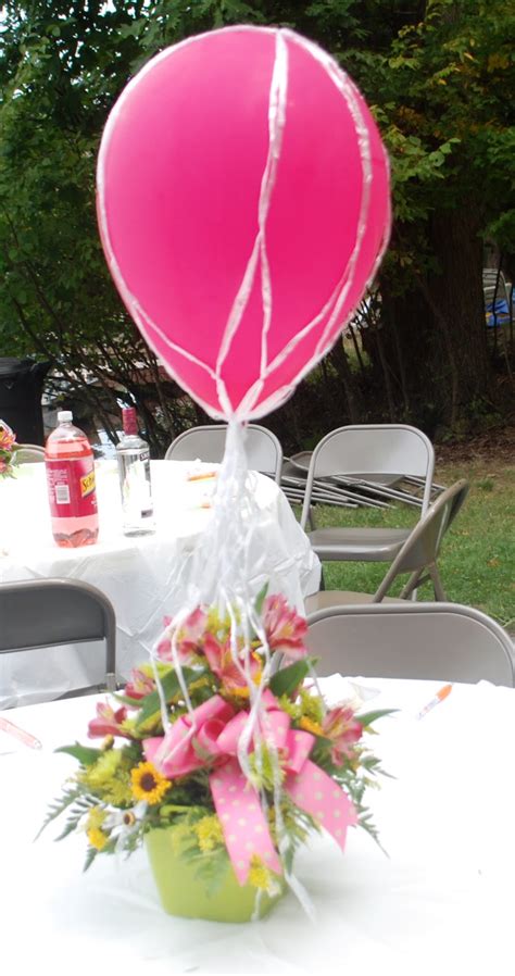 We decided to highlight ours with a dessert table underneath complete with sweet treats and beautiful florals although, you don't. party paper scissors: Hot Air Balloon Baby Shower