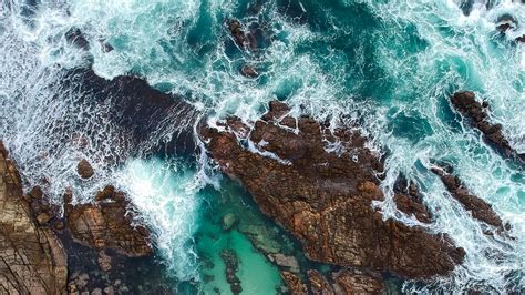 Download Wallpaper 1600x900 Rocks Ocean Aerial View Coast Waves