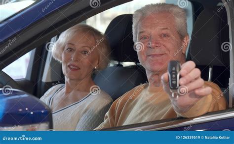 senior couple talks inside the car stock image image of business indoors 126339519