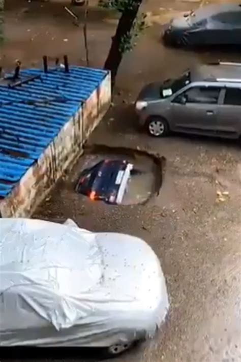 Video Terrifying Footage Shows Car Being Swallowed Whole By A