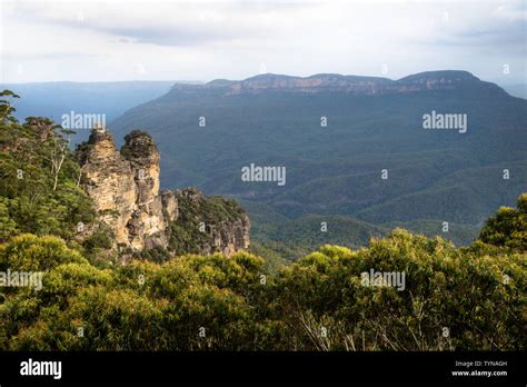 Two Of The Three Sisters Rock Formation In The Blue Mountains With
