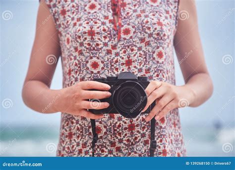 A Young Girl Holding A Camera Stock Photo Image Of Hobby Photograph