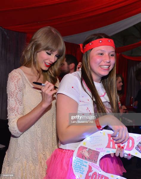 Singer Taylor Swift Meets A Fan In Club Red After Her Show At The
