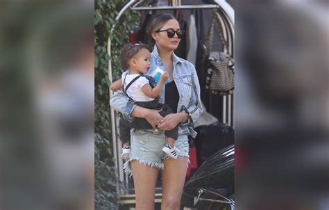 Chrissy Teigen Wears Daisy Dukes While Out With Luna