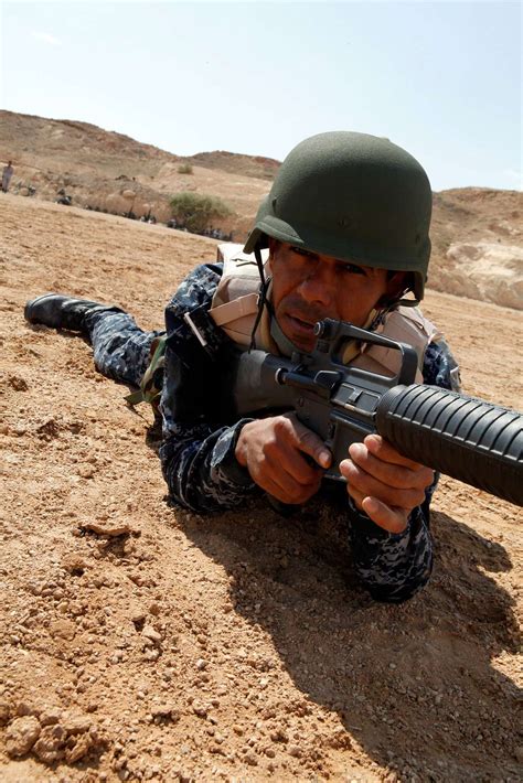 A Member Of The Iraqi Federal Police Force Aims At Nara And Dvids