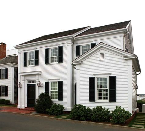 This house's orange roofing injects visual warmth and. Black Shutters - Traditional - home exterior - New England ...