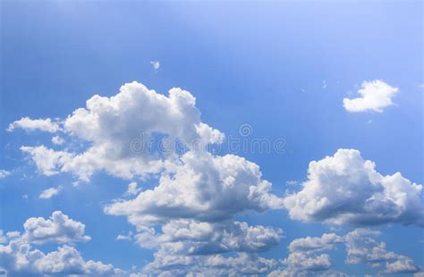 Blue Sky With Puffy White Clouds In Bright Clear Sunny Day Stock Image