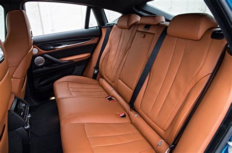 Here is diy for removing the rear seats on 5er f10 without through loading option (465) there are different possible there are two notches (shown in pics) that are holding it in place each one approximately at the center of each of the back seats. BMW X6 M Review (2020) | Autocar
