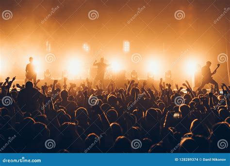 Silhouettes Of Concert Crowd In Front Of Bright Stage Lights A Sold