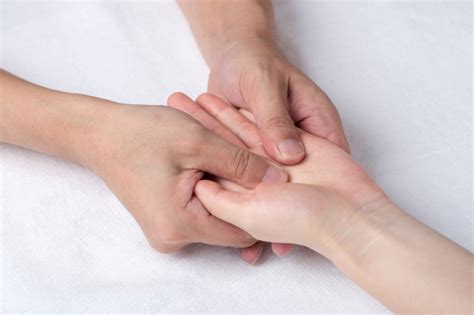 Premium Photo Physiotherapist Doing Hand Massage In Medical Office