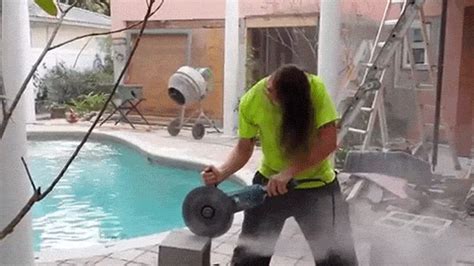 Fun Guy Spins His Head Like A Metal Rock Star While Doing Construction