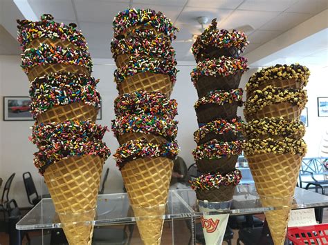 Waffle Cones Dipped In Chocolate And Sprinkled With Nuts Or Rainbow
