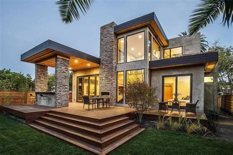 Concrete And Rough Stone Facade For Two Story Modern Home With Wooden